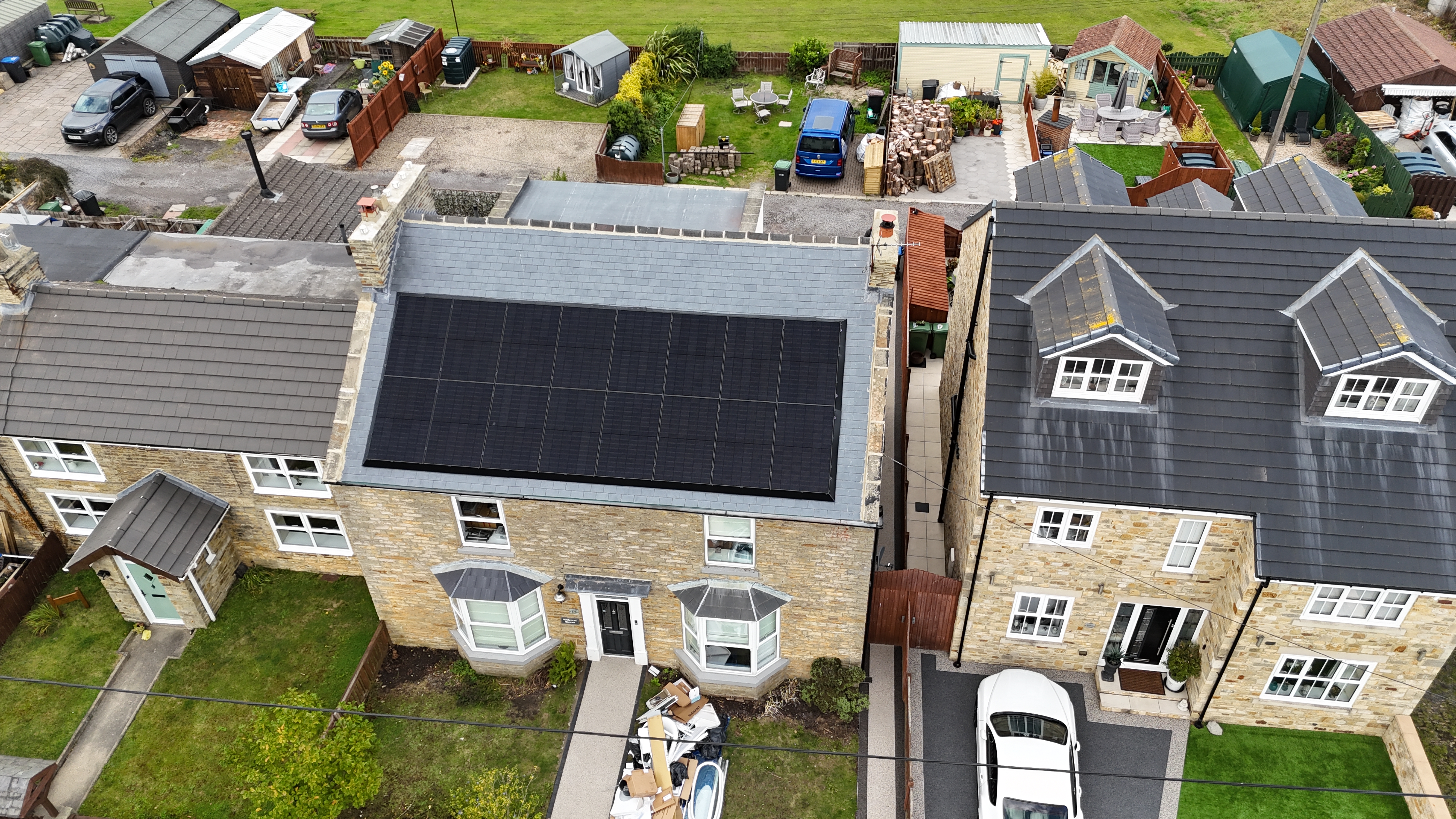 Aerial drone view of solar panels on a Yorkshire terrace by Premier Electrical Renewables