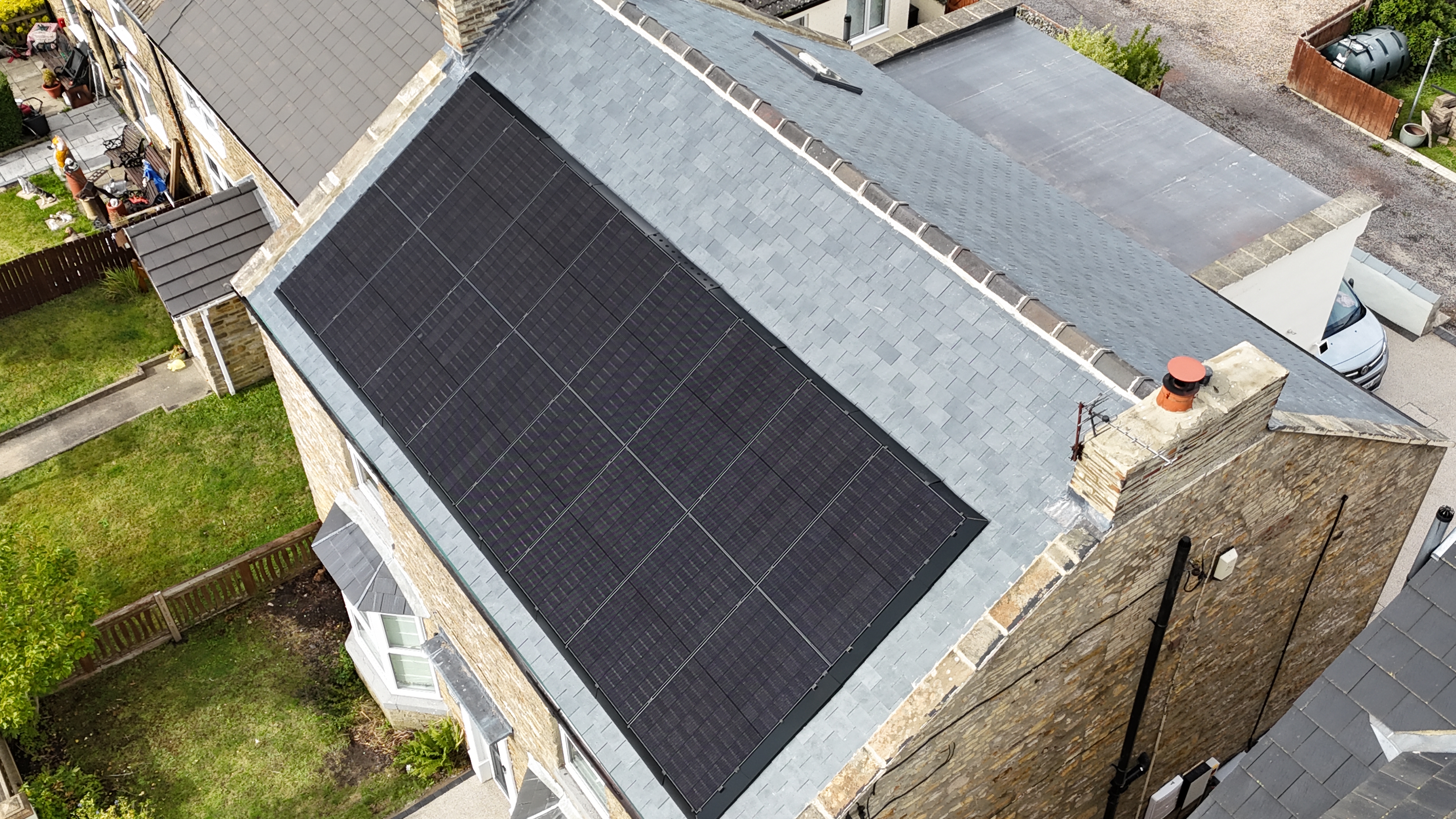 Aerial view of 18-panel solar installation on Yorkshire stone house by Premier Electrical Renewables