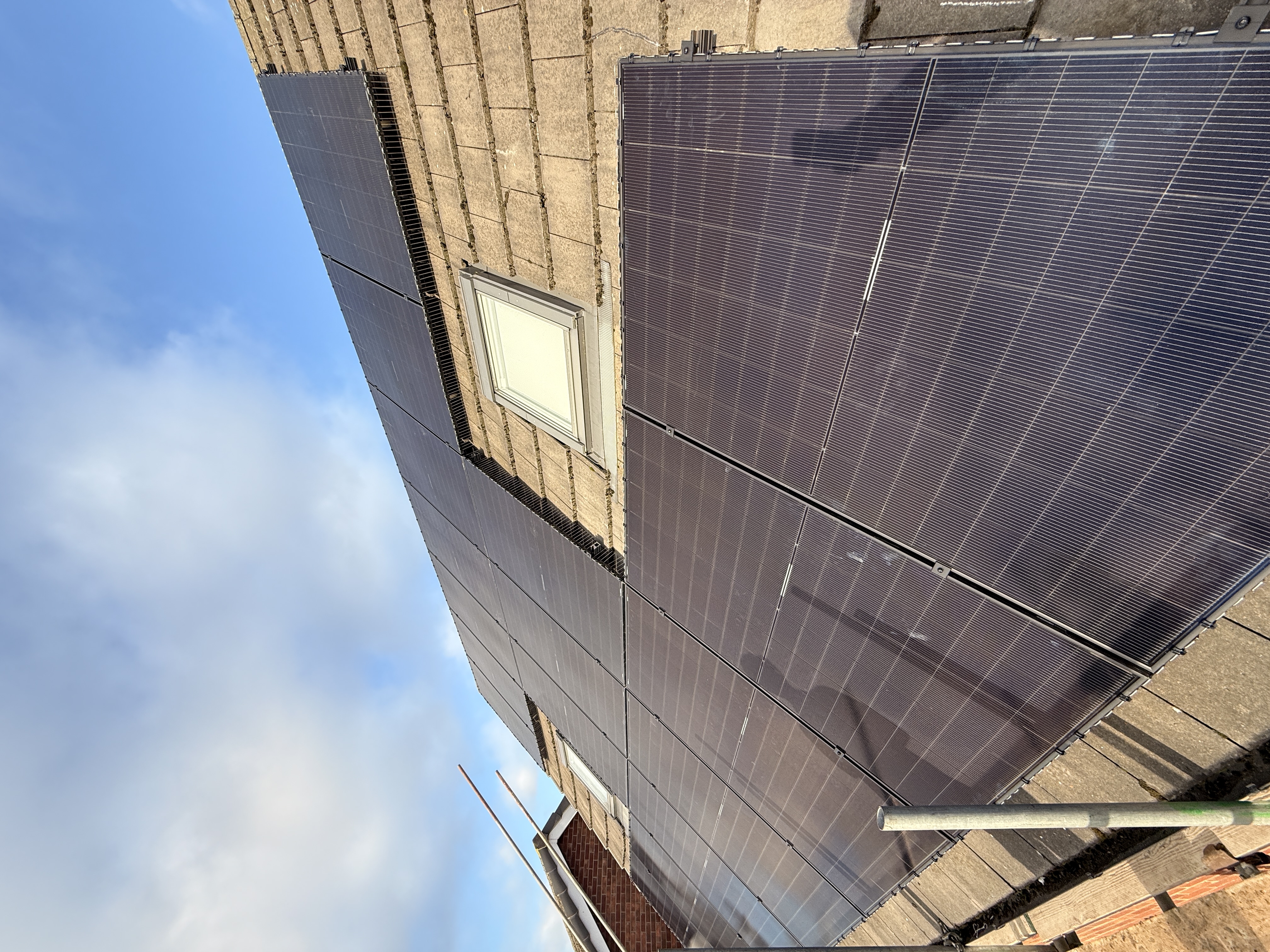 Solar panels being fitted to a Yorkshire roof on scaffolding during active installation