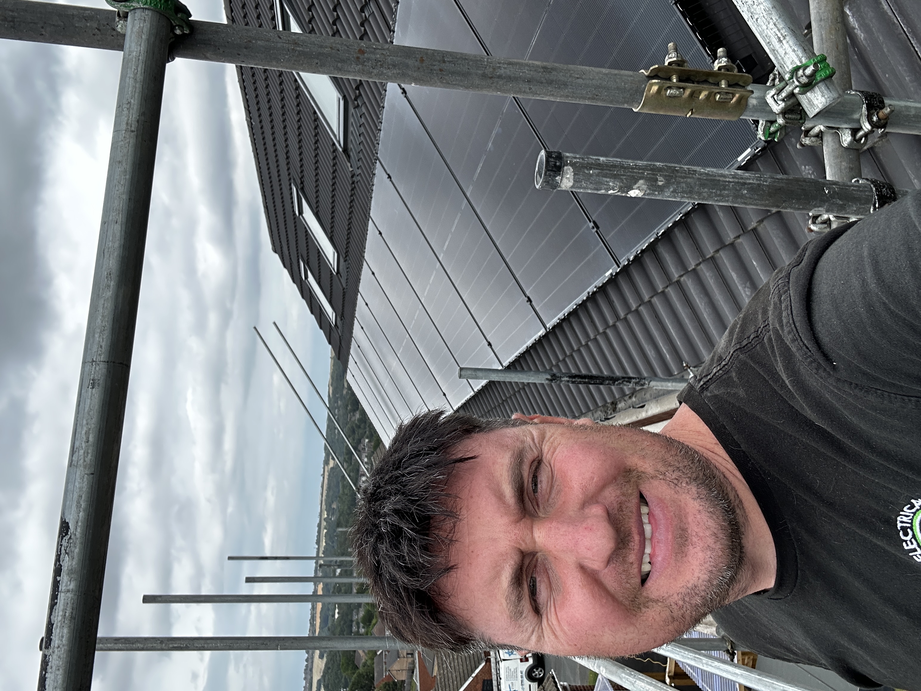 James Gascoigne, founder of Premier Electrical Renewables, on site installing solar panels